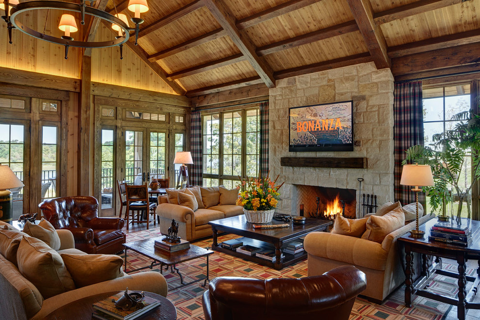 Rustic formal open plan living room in San Francisco with a standard fireplace, a stone fireplace surround, a wall mounted tv, brown walls and slate flooring.