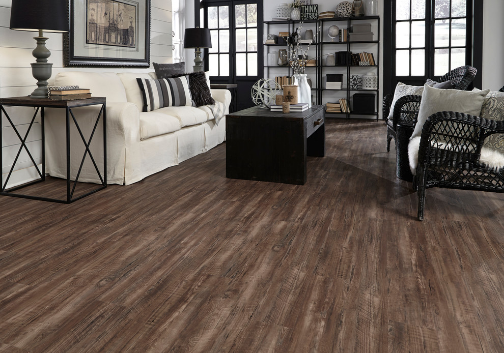 Inspiration for a mid-sized industrial formal and open concept vinyl floor and brown floor living room remodel in Other with brown walls
