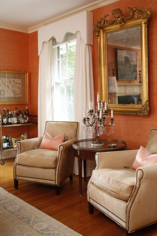 Идея дизайна: большая открытая, парадная гостиная комната в классическом стиле с оранжевыми стенами и светлым паркетным полом