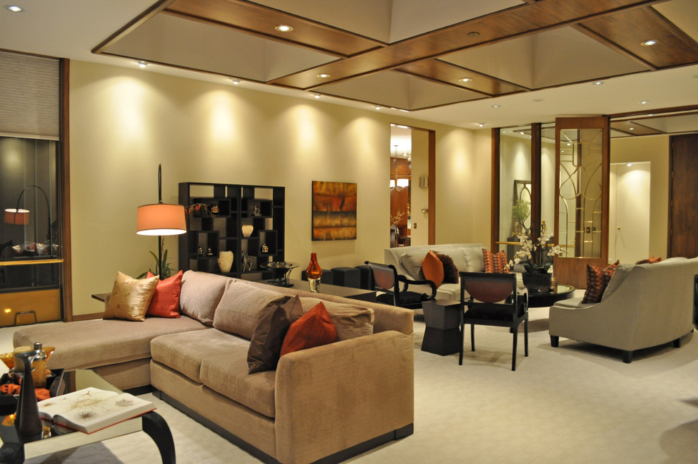 Ispirazione per un ampio soggiorno design con pareti beige