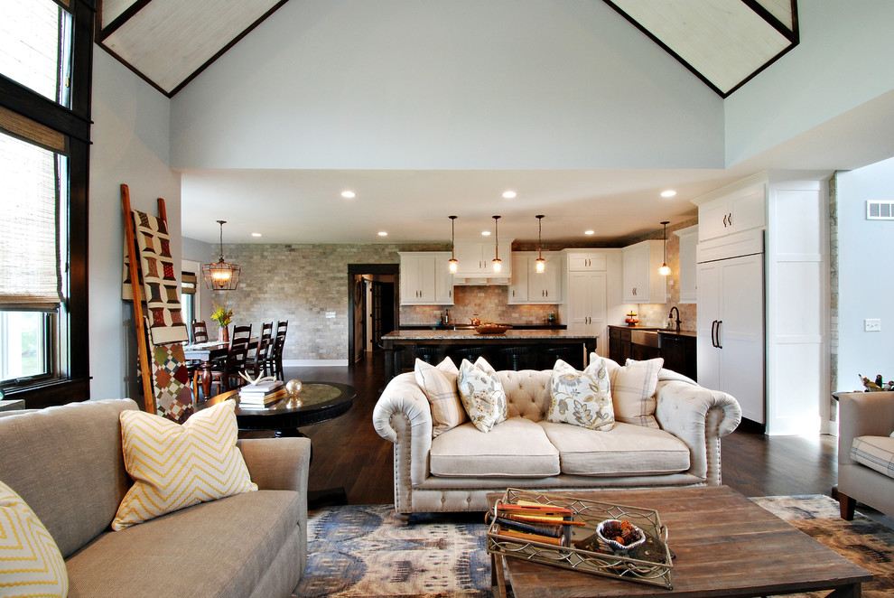 Inspiration for a large transitional open concept dark wood floor living room remodel in Kansas City with white walls