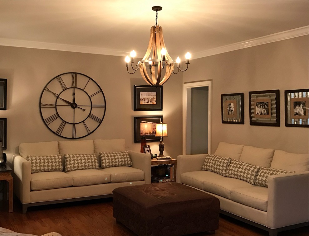 Example of a mid-sized transitional formal and enclosed medium tone wood floor living room design in Other with beige walls, no fireplace and no tv