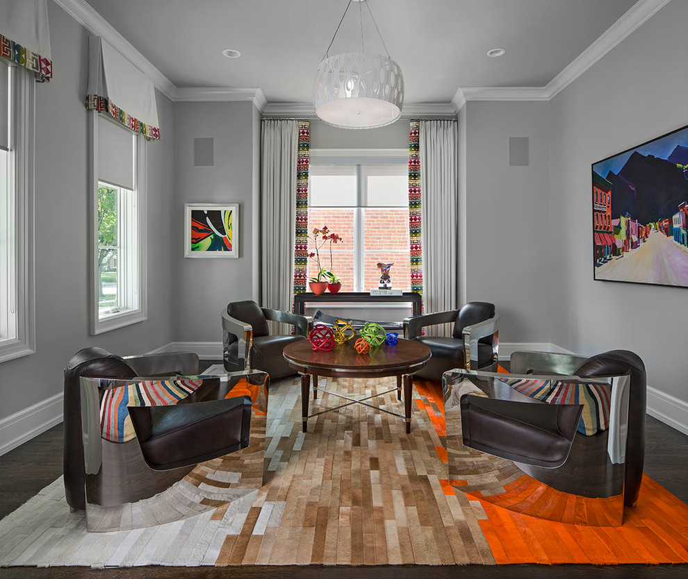 Medium sized classic formal enclosed living room in Detroit with grey walls, dark hardwood flooring and brown floors.