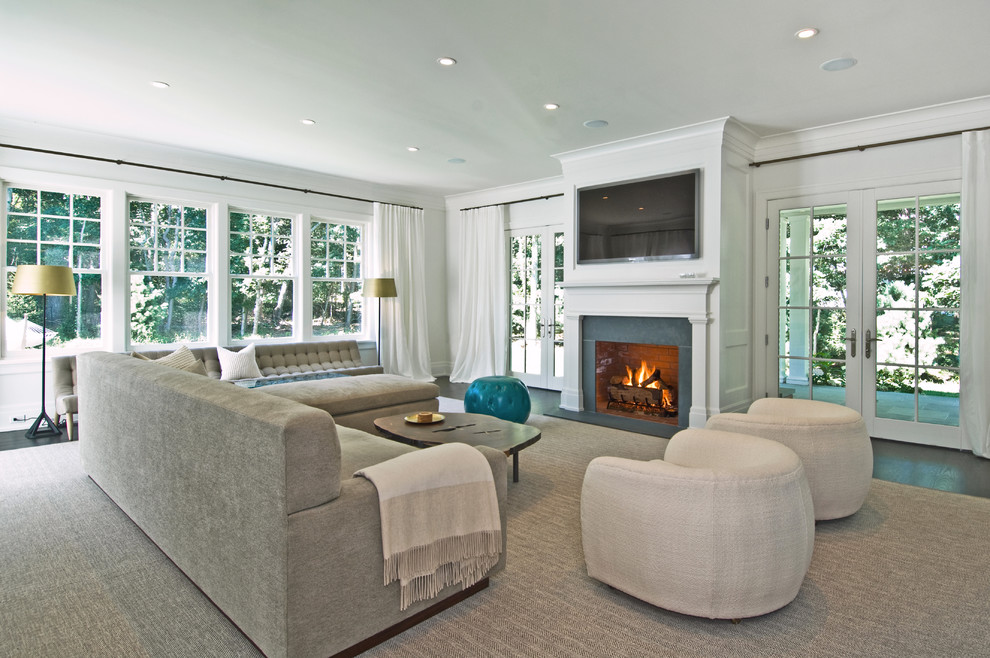 Example of a transitional living room design in New York with white walls