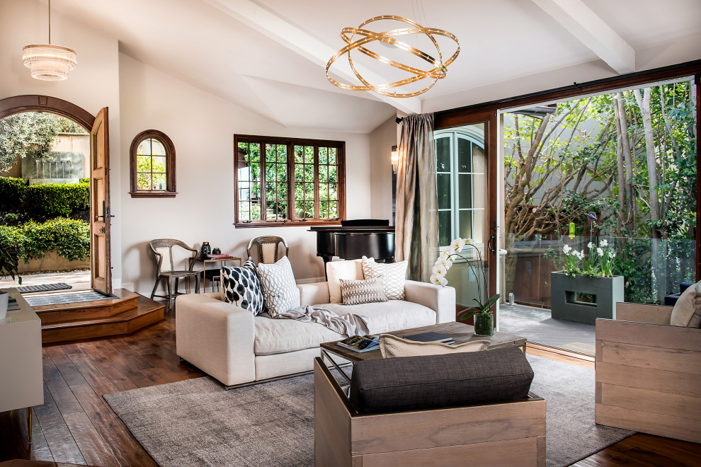 Transitional open concept dark wood floor and brown floor living room photo in San Francisco with white walls