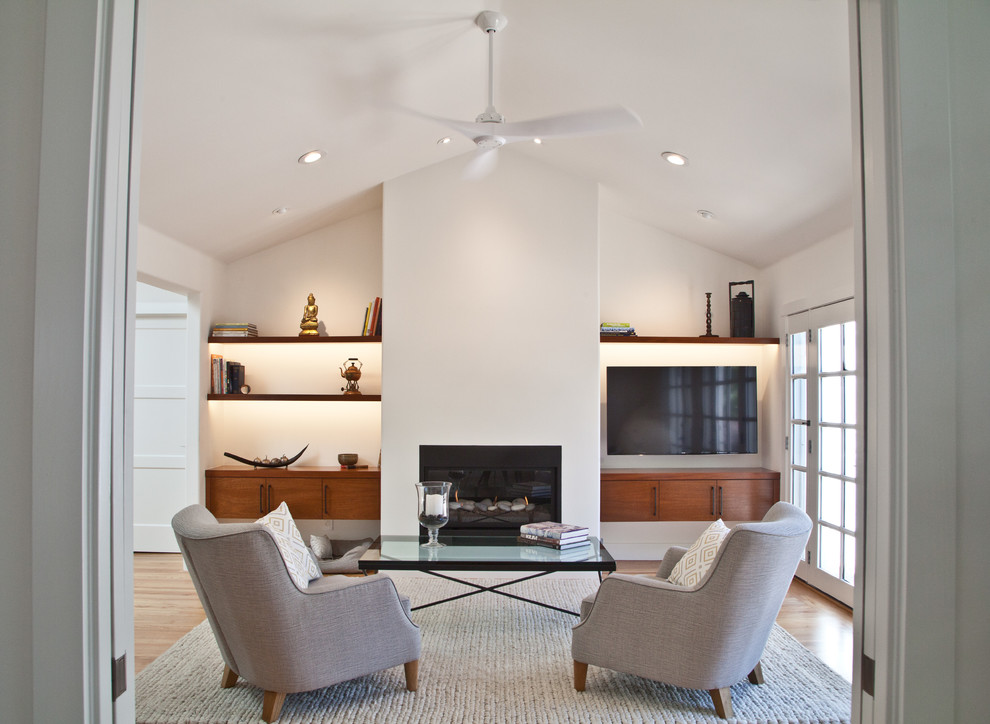 Living room - large transitional formal and open concept medium tone wood floor living room idea in San Francisco with white walls, a wall-mounted tv, a metal fireplace and a ribbon fireplace