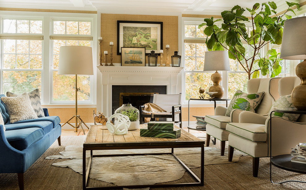 Example of a transitional formal living room design in Boston with beige walls and a standard fireplace