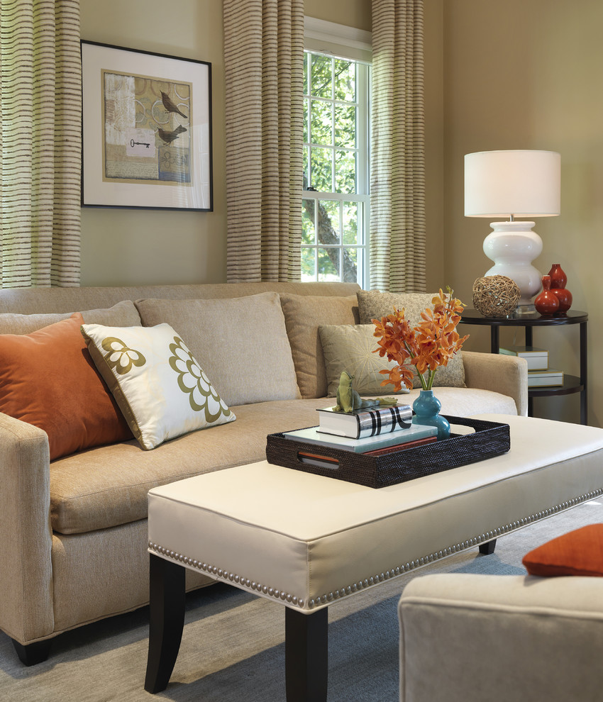 Photo of a traditional living room in Boston with beige walls and feature lighting.