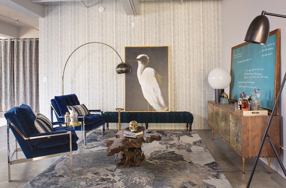 Idée de décoration pour un salon tradition avec un mur gris et sol en béton ciré.