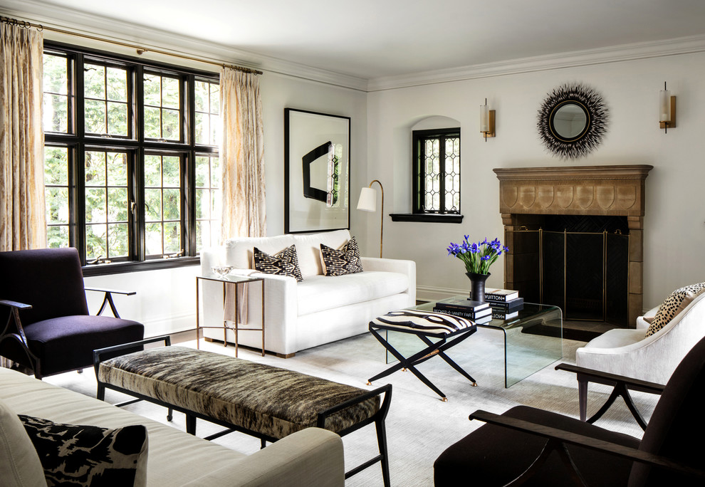 Transitional formal living room photo in New York with white walls and a standard fireplace