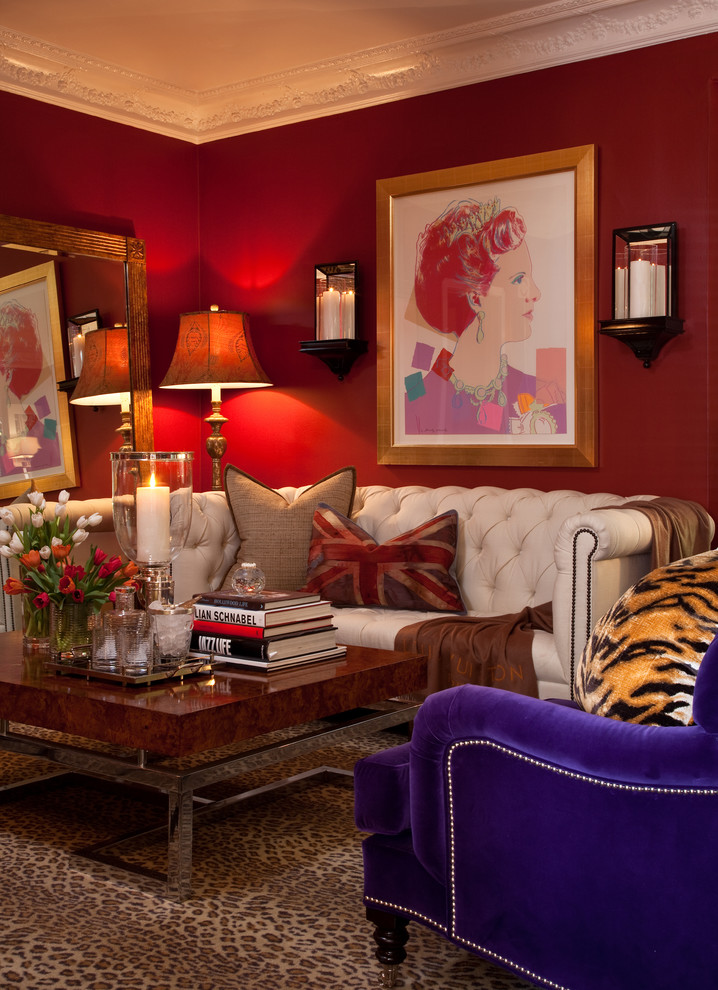This is an example of an eclectic formal enclosed living room in Los Angeles with red walls.