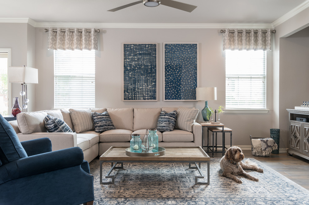 Inspiration for a mid-sized transitional open concept brown floor and medium tone wood floor living room remodel in Dallas with gray walls and a tv stand