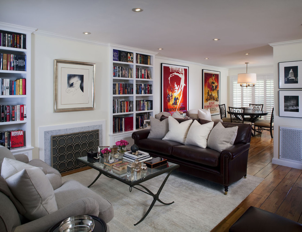 Small trendy formal and open concept medium tone wood floor living room photo in Los Angeles with a standard fireplace, white walls and a stone fireplace