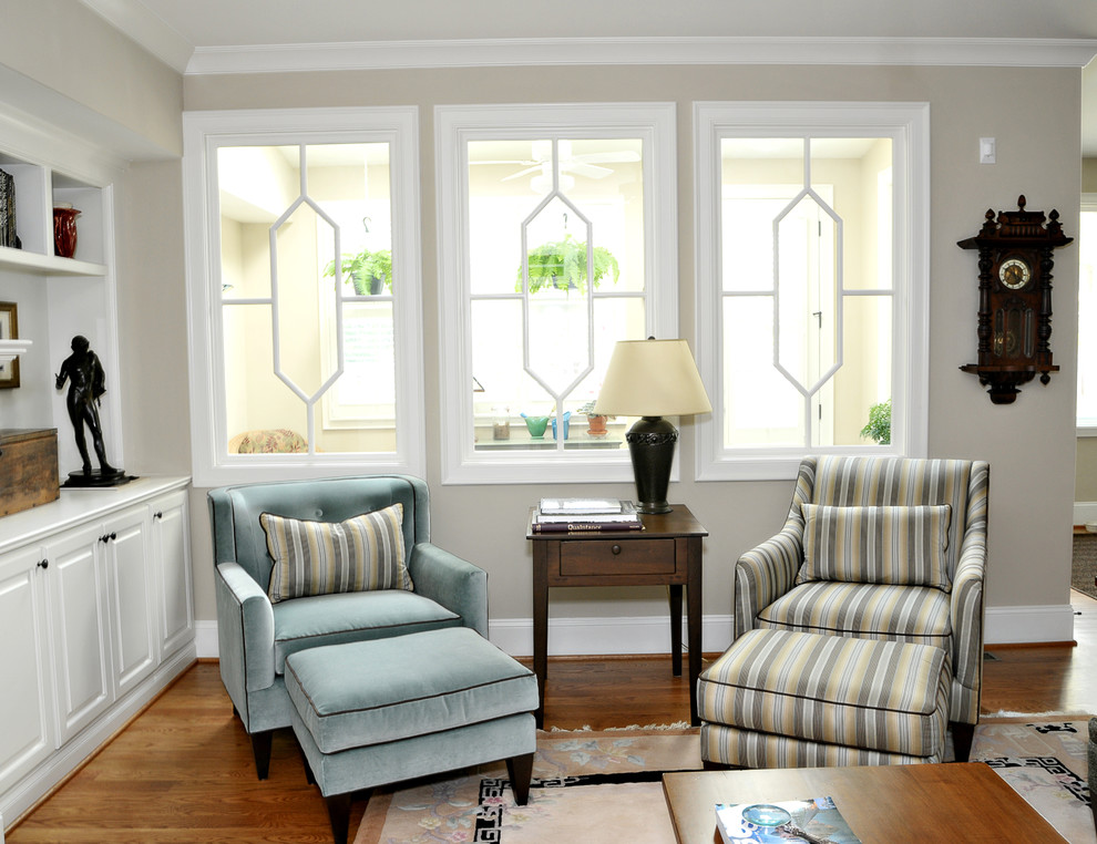 Inspiration for a timeless living room remodel in Raleigh with beige walls