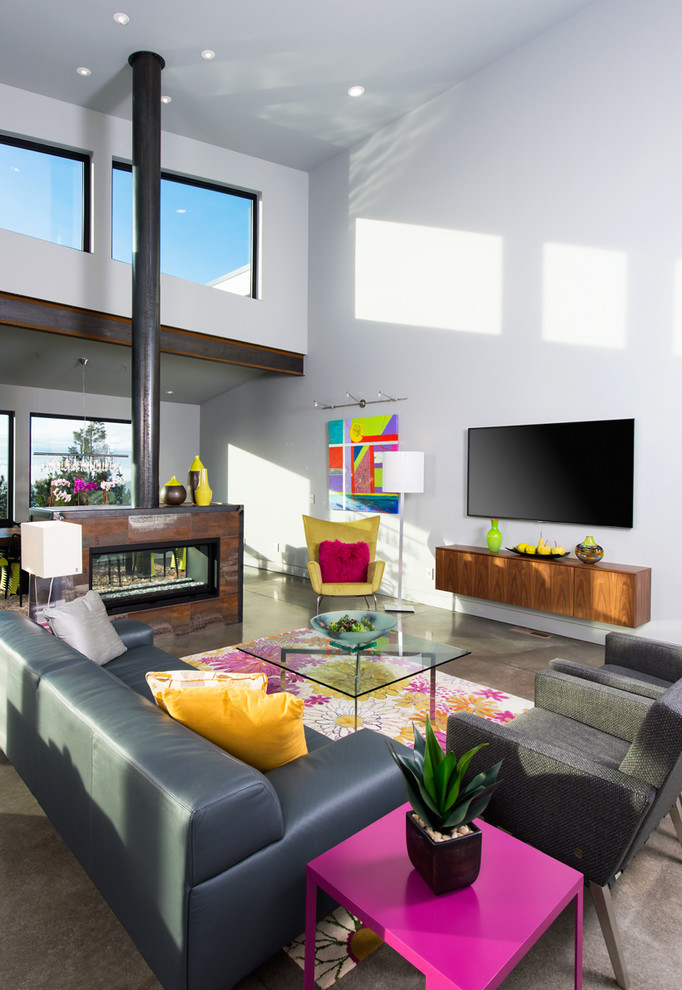 Photo of a medium sized contemporary formal open plan living room in Other with white walls, concrete flooring, a two-sided fireplace, a metal fireplace surround and a wall mounted tv.