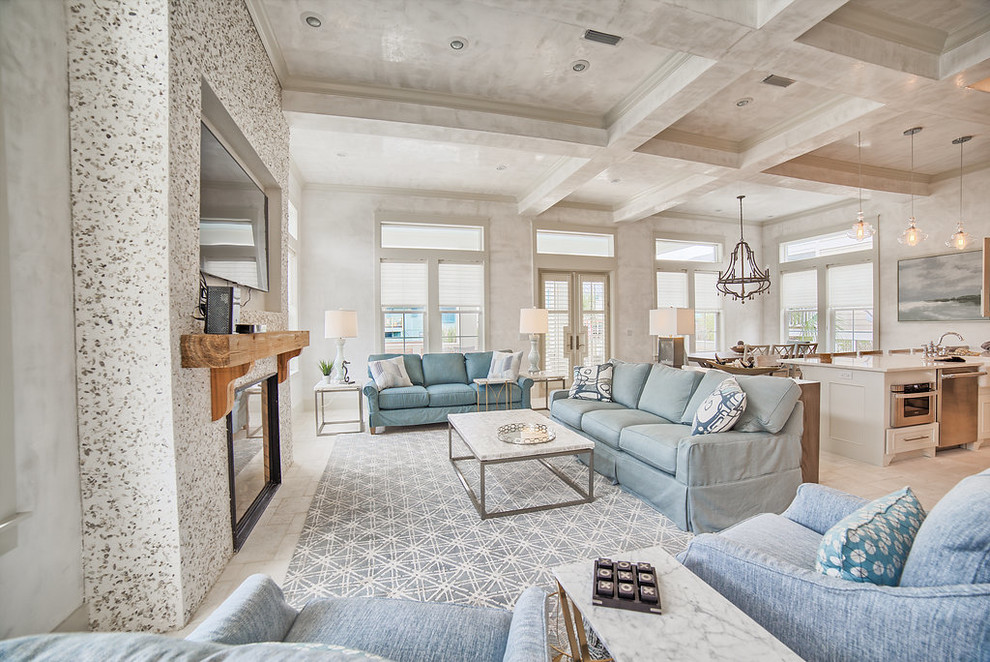 Living room - mid-sized coastal formal and open concept ceramic tile and gray floor living room idea in Miami with gray walls, a standard fireplace, a concrete fireplace and a wall-mounted tv