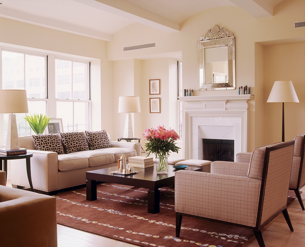 Photo of a medium sized midcentury mezzanine living room in New York with beige walls, light hardwood flooring, a standard fireplace and a stone fireplace surround.