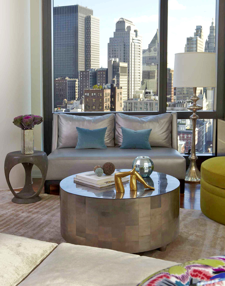 Example of a trendy medium tone wood floor living room design in New York