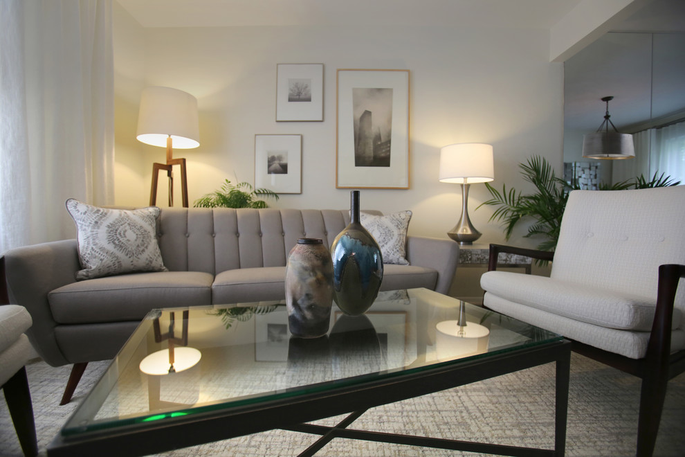 Immagine di un soggiorno moderno di medie dimensioni e aperto con pareti grigie, moquette, nessun camino, nessuna TV e pavimento grigio