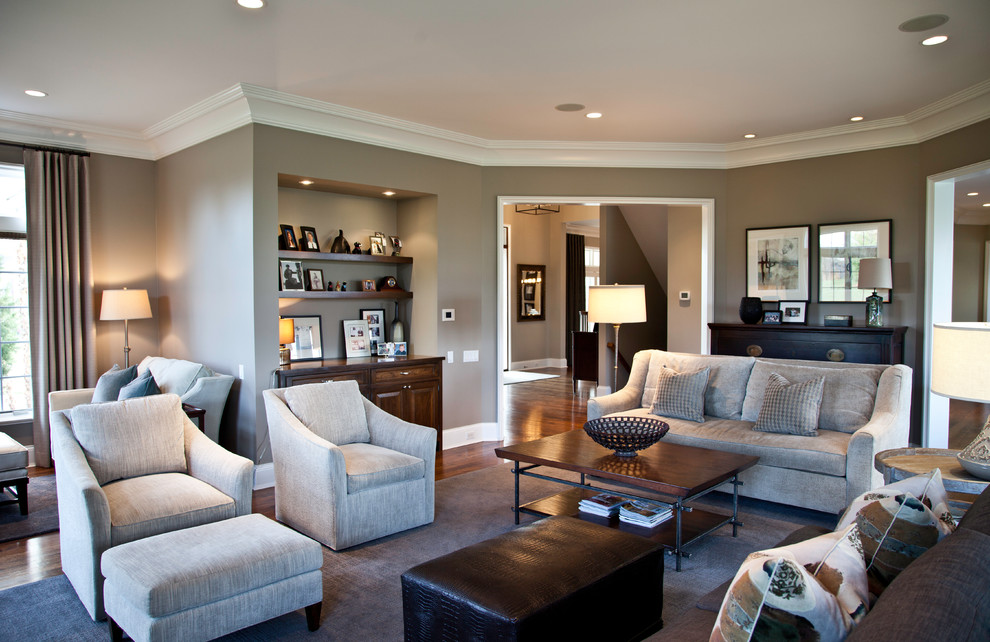 Large transitional enclosed medium tone wood floor living room photo in Milwaukee