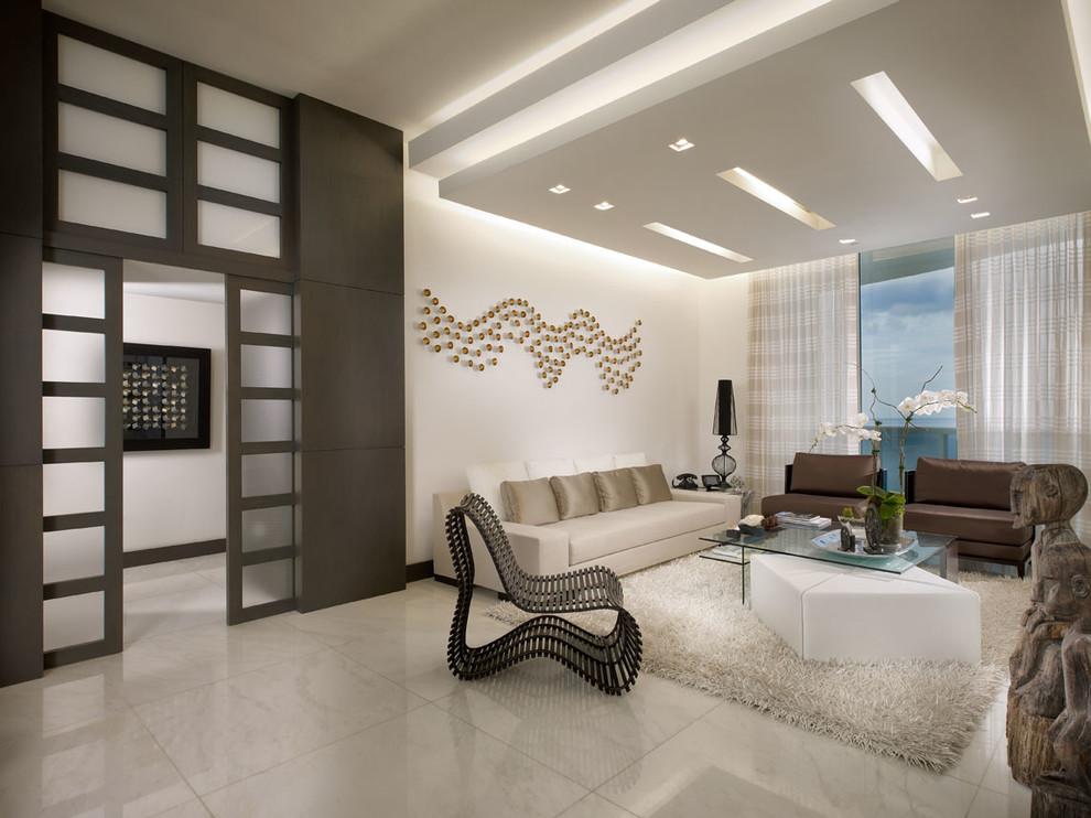 Example of a trendy marble floor living room design in Miami with white walls