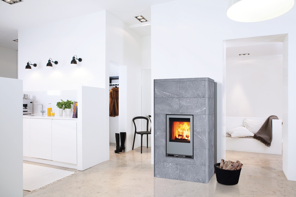 Example of a large danish living room design in Gloucestershire with a wood stove