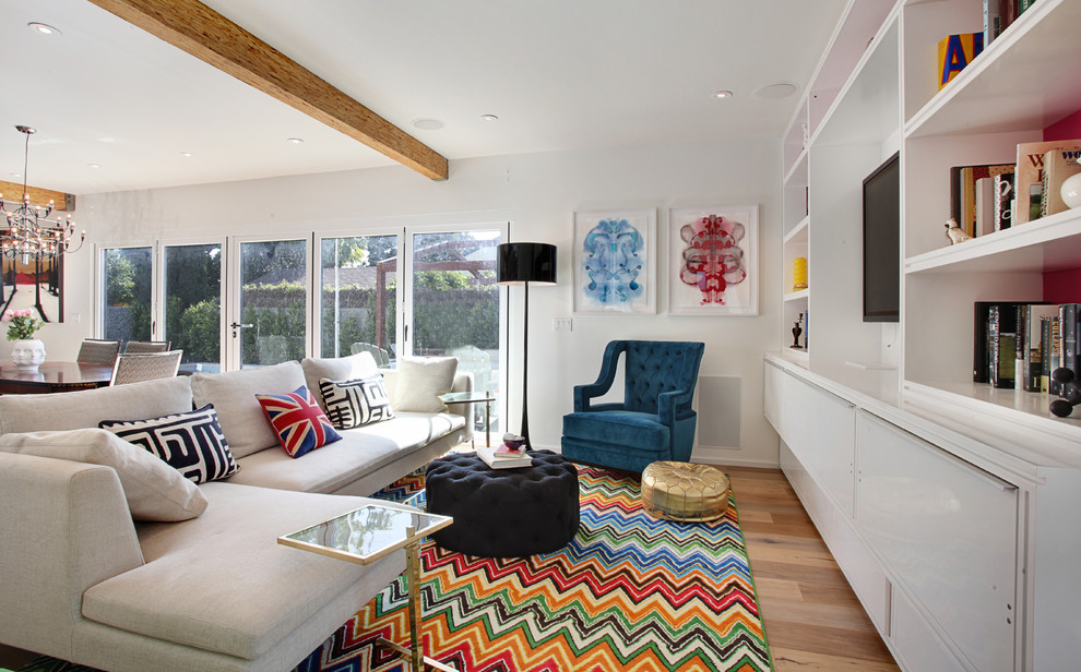 Living room - contemporary open concept living room idea in Los Angeles with a media wall