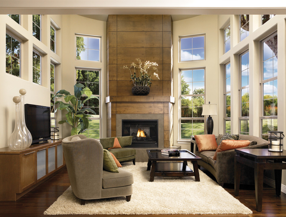 Inspiration for a mid-sized contemporary open concept dark wood floor and brown floor living room remodel in San Francisco with beige walls, a standard fireplace, a metal fireplace and a tv stand