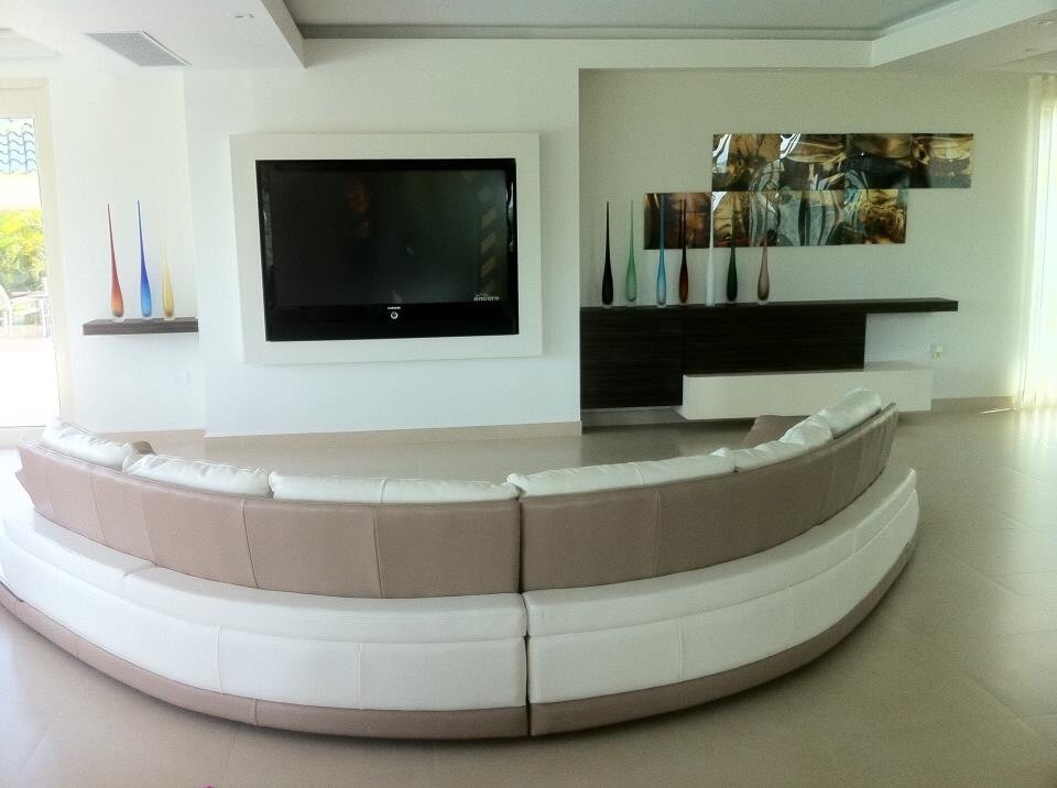 Photo of a medium sized modern open plan living room in Miami with a reading nook, beige walls, porcelain flooring, no fireplace and a wall mounted tv.