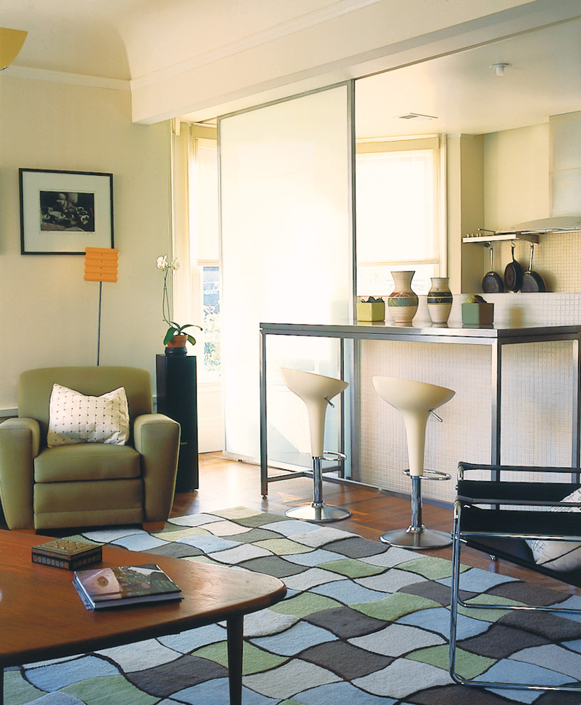 Living room - industrial living room idea in San Francisco with beige walls