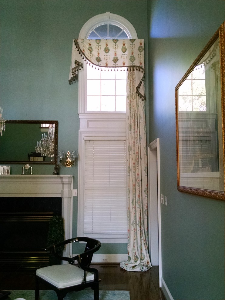Two story windows, combined panels and treatments Living Room