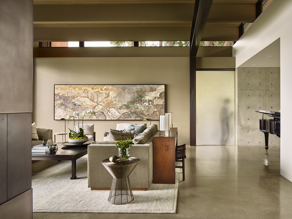 Contemporary living room in Seattle with grey walls, concrete flooring and grey floors.