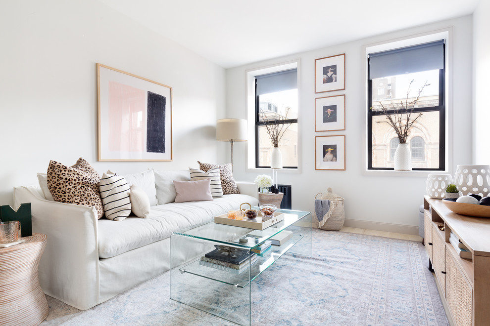 Photo of a medium sized classic open plan living room in New York with grey walls, light hardwood flooring, no fireplace, a wall mounted tv and beige floors.