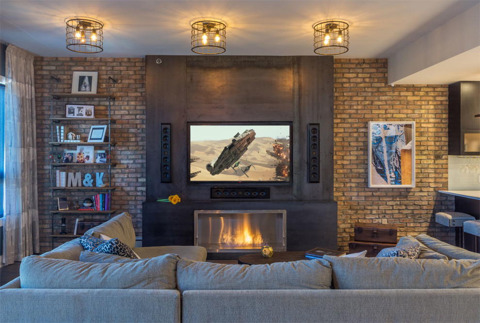 Photo of a medium sized urban formal enclosed living room in New York with beige walls, dark hardwood flooring, no fireplace, a wall mounted tv and a metal fireplace surround.