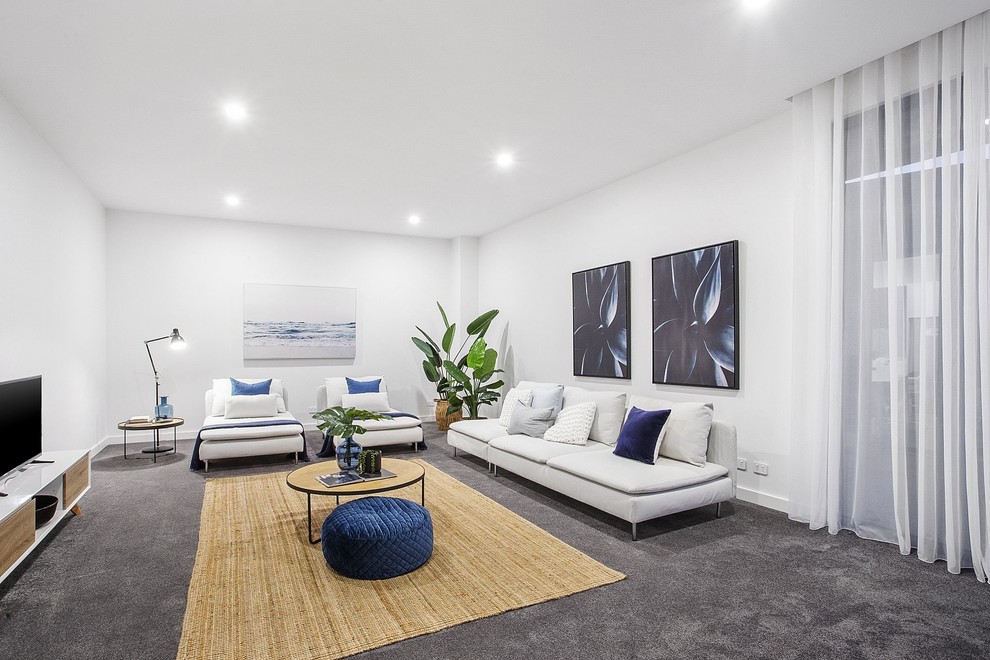 Idéer för att renovera ett funkis separat vardagsrum, med vita väggar, heltäckningsmatta, en fristående TV och grått golv