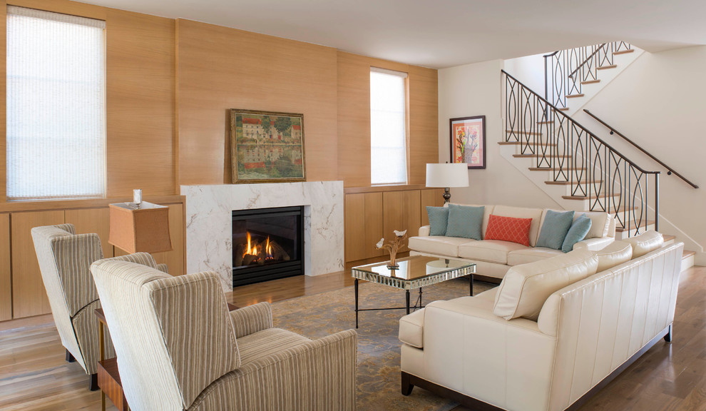 Inspiration for a transitional open concept medium tone wood floor living room remodel in Dallas with a standard fireplace
