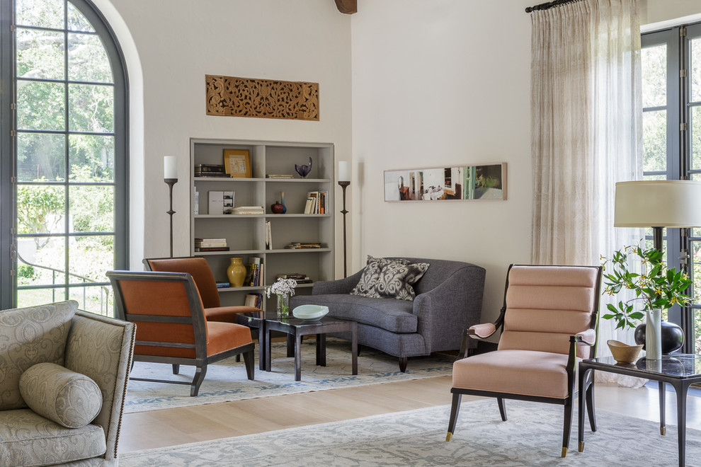 Inspiration for a large mediterranean formal enclosed living room in San Francisco with white walls, light hardwood flooring, no tv and brown floors.