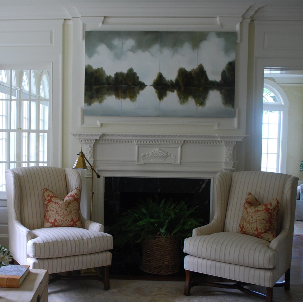 Photo of a classic living room in Atlanta with a wooden fireplace surround.