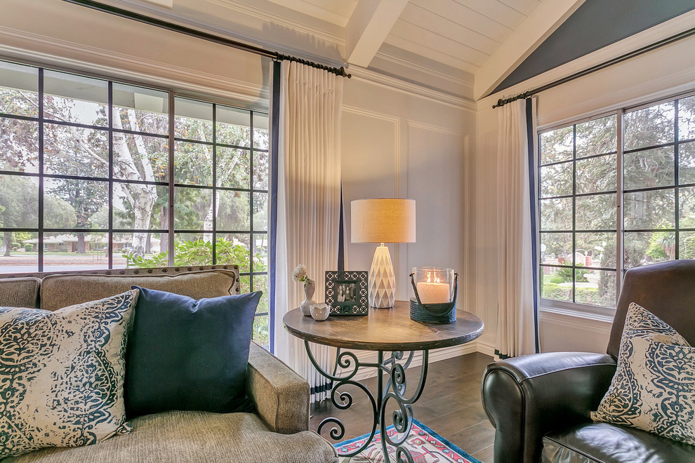 Living room - large traditional formal and open concept medium tone wood floor living room idea in Los Angeles with blue walls, no fireplace and a tv stand