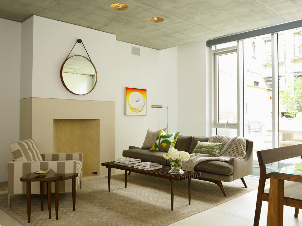 Example of a trendy living room design in New York with white walls