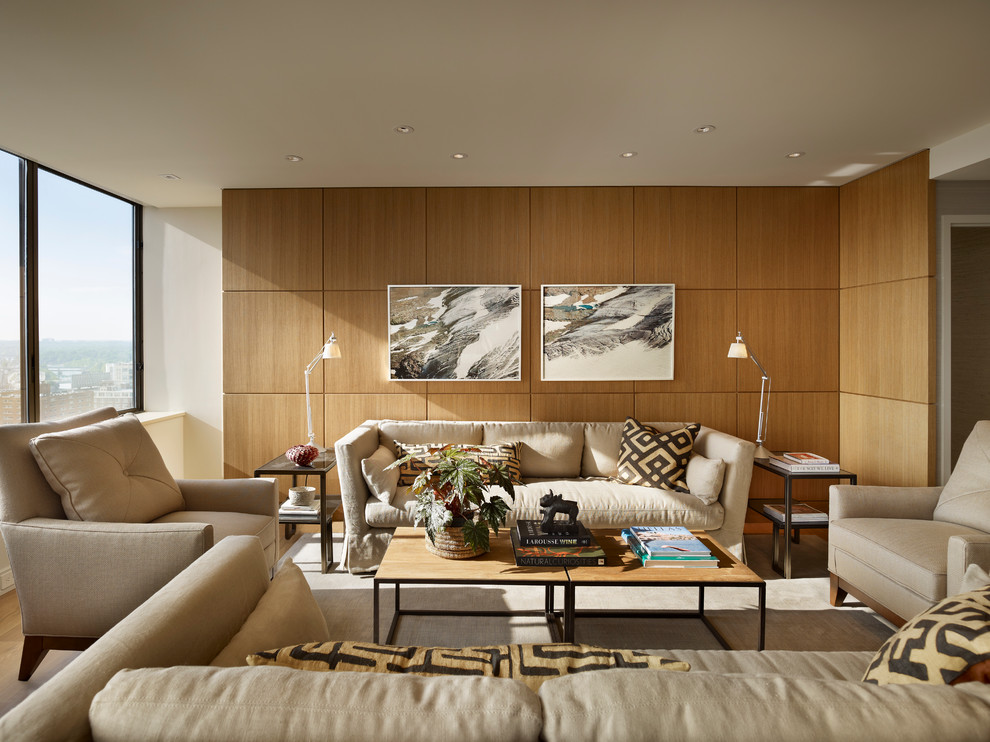 Идея дизайна: открытая гостиная комната среднего размера в современном стиле с белыми стенами, светлым паркетным полом и скрытым телевизором без камина
