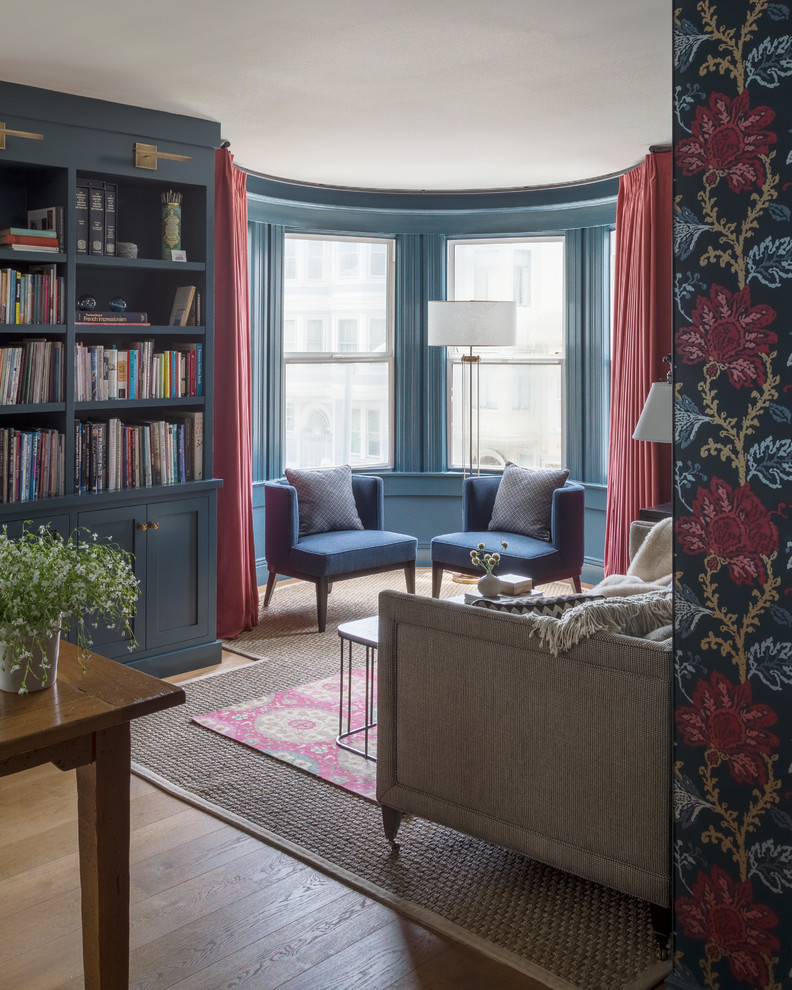 Living room library - transitional living room library idea in San Francisco with blue walls