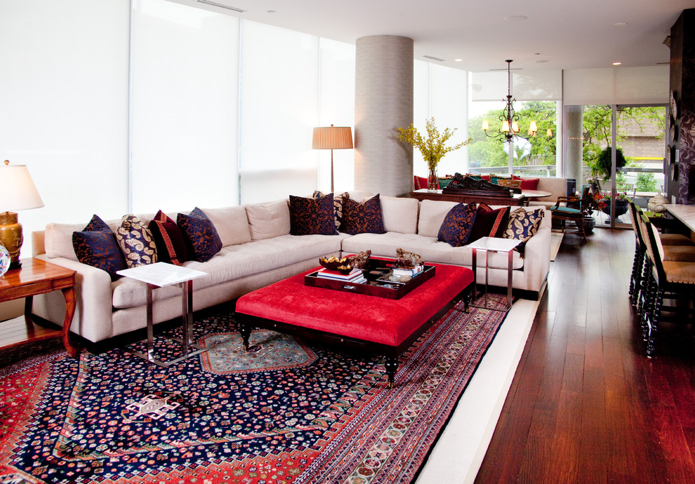 Photo of an eclectic open plan living room in Chicago with a home bar and red floors.