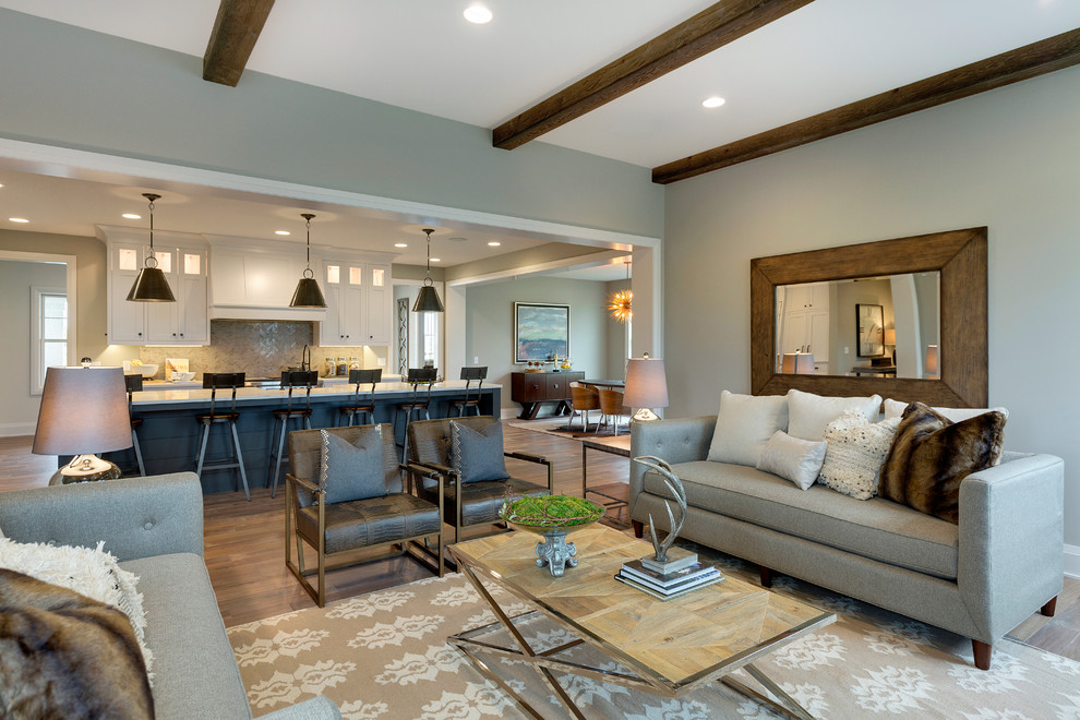 Example of a large transitional open concept medium tone wood floor living room design in Minneapolis with gray walls, a standard fireplace, a tile fireplace and a wall-mounted tv