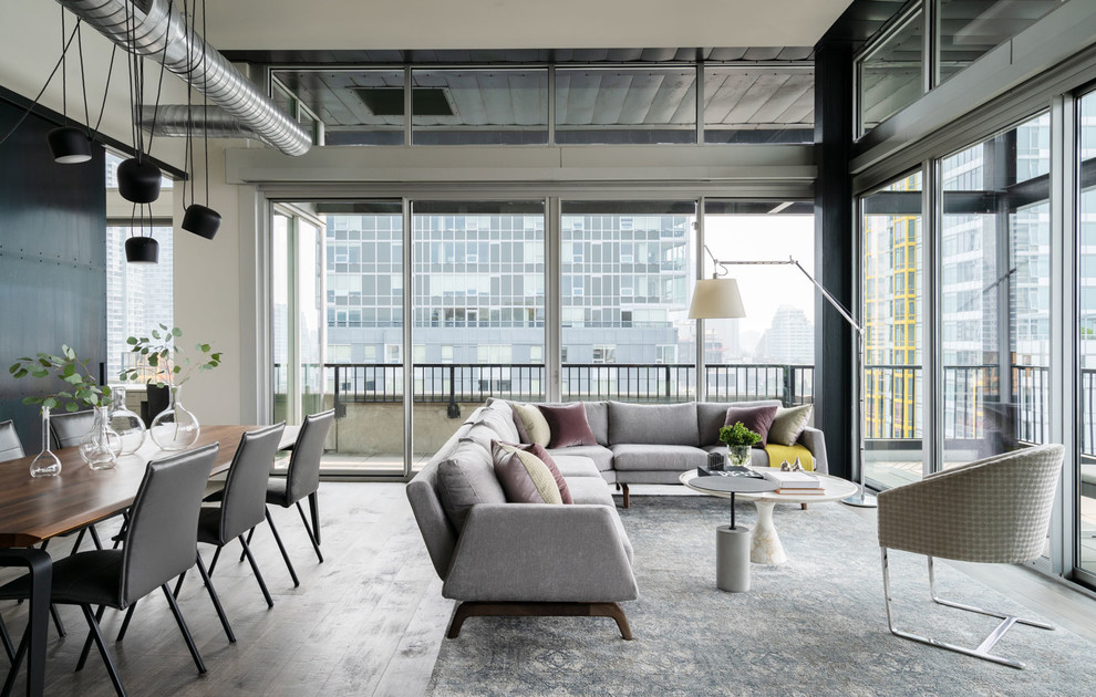 Inspiration for a mid-sized industrial open concept and formal dark wood floor living room remodel in Seattle with white walls and no fireplace