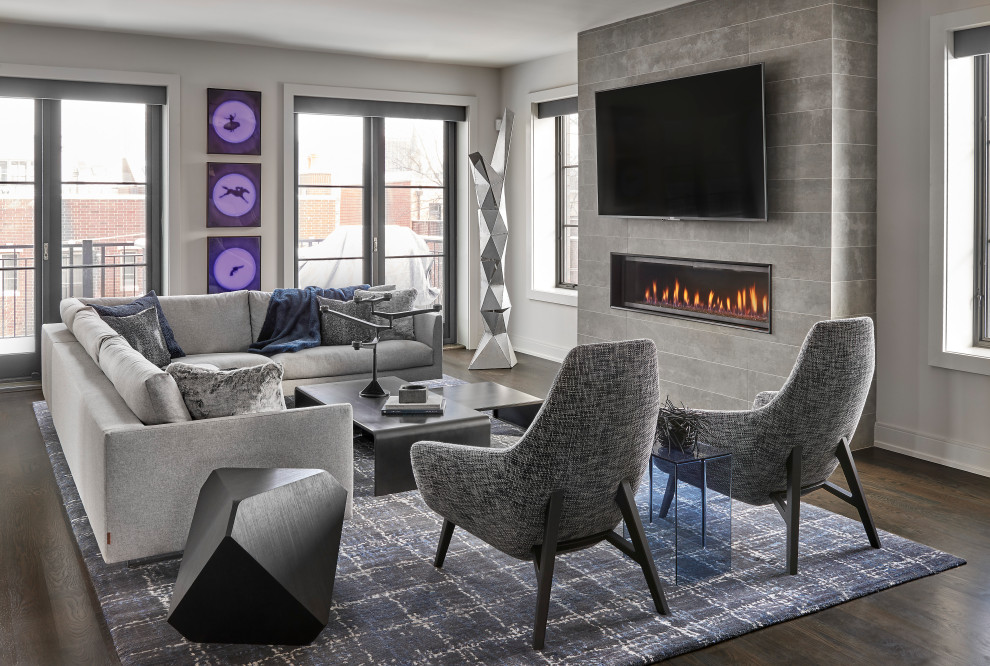 Inspiration for a large contemporary open plan living room in Chicago with grey walls, dark hardwood flooring, a tiled fireplace surround, a wall mounted tv, a ribbon fireplace and brown floors.
