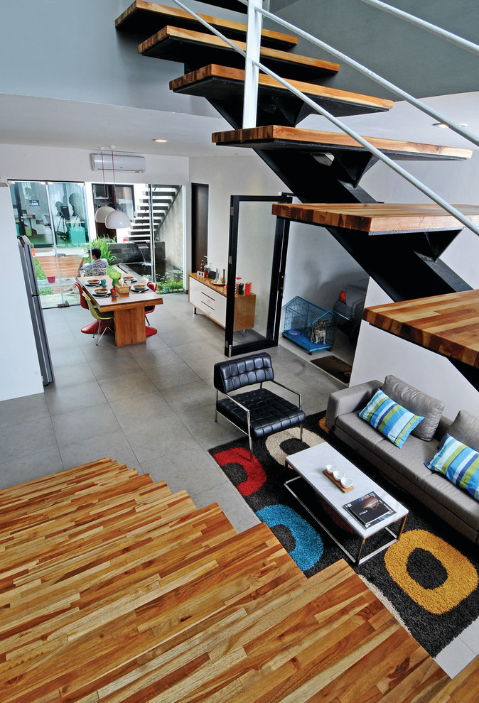 Mittelgroßes, Repräsentatives, Fernseherloses, Offenes Modernes Wohnzimmer mit grauer Wandfarbe und Keramikboden in Sonstige