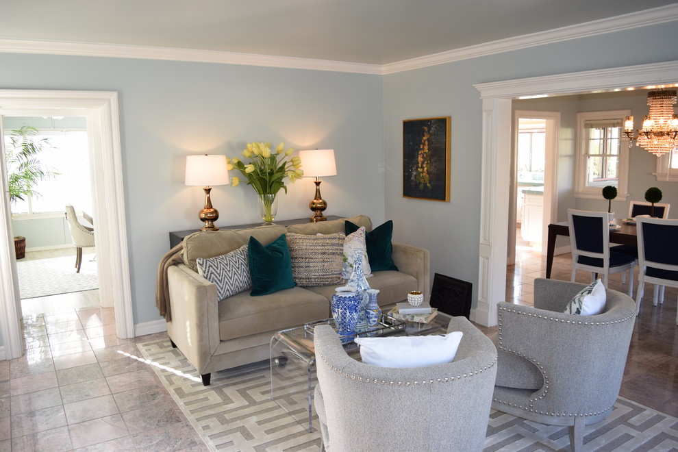 Small traditional open plan living room in Los Angeles with blue walls, ceramic flooring, no fireplace, no tv and feature lighting.