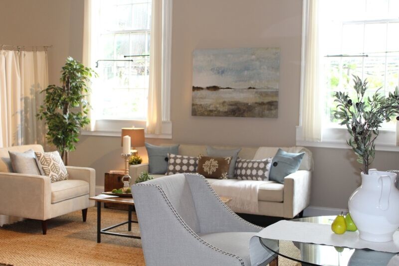 Design ideas for a medium sized urban mezzanine living room in Boston with beige walls, dark hardwood flooring and a freestanding tv.