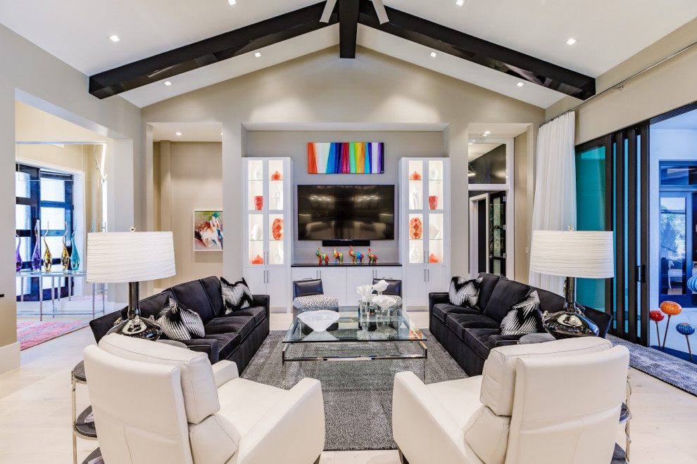 Trendy open concept beige floor, exposed beam and vaulted ceiling living room photo in Tampa with beige walls